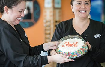 Schatz Orthodontics team with a Smile cake.